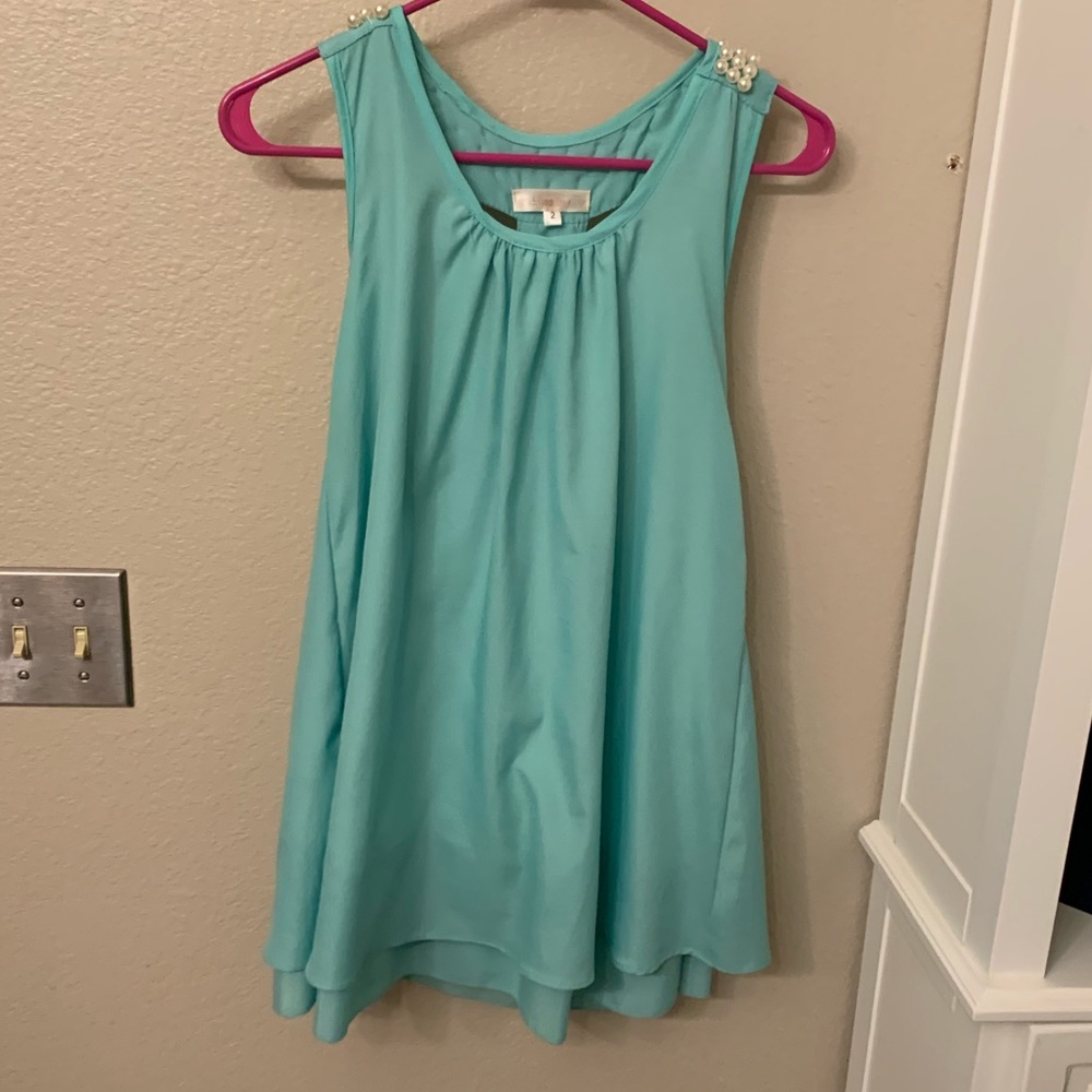 Mini teal dress with pearl details on the back